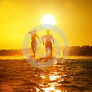 Group of friends having fun on the beach