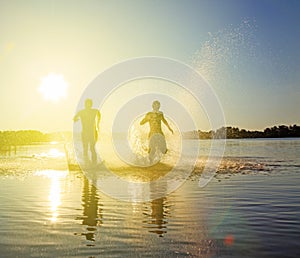 Group of friends having fun on the beach