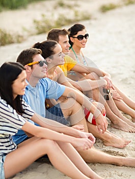 Group of friends having fun on the beach