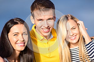 Group of friends having fun on the beach