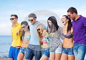 Group of friends having fun on the beach