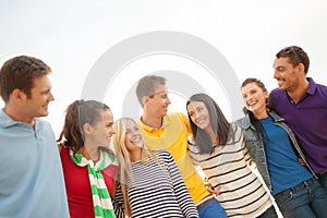 Group of friends having fun on the beach