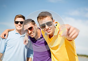 Group of friends having fun on the beach