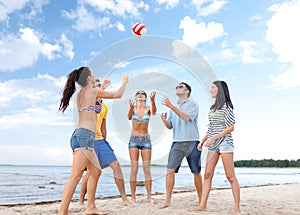 Group of friends having fun on the beach