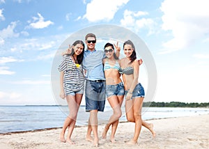 Group of friends having fun on the beach