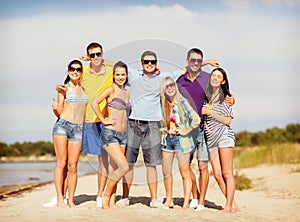 Group of friends having fun on the beach