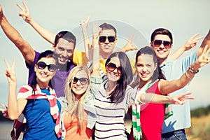 Group of friends having fun on the beach