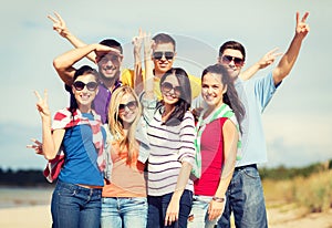 Group of friends having fun on the beach