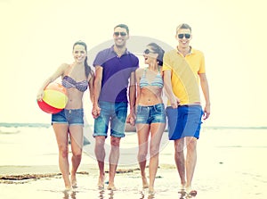 Group of friends having fun on the beach