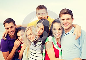 Group of friends having fun on the beach