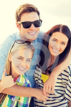 Group of friends having fun on the beach