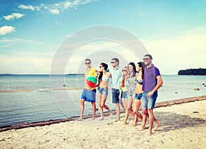 Group of friends having fun on the beach