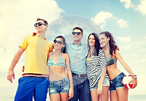 Group of friends having fun on the beach