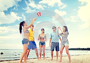 Group of friends having fun on the beach