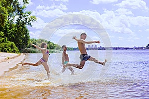 Group of friends having fun on the beach