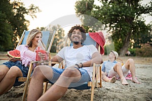 Group of friends having fun on the beach. Summer, fun, people, vacation concept.