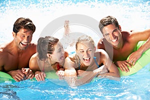 Group Of Friends Having Fun In Swimming Pool