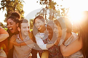 Group Of Friends Having Fun Together Outdoors