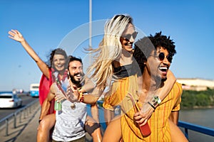 Group of friends having fun, traveling, smiling together outdoors