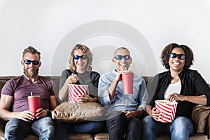 Group of friends having fun watching movie together