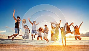 Group of friends jumping on beach