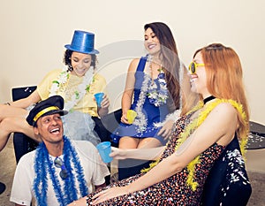 Group of friends is laughing and having fun. Dressed revelers ar photo
