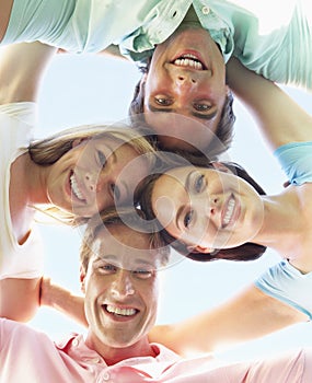 Group Of Friends Looking Down Into Camera