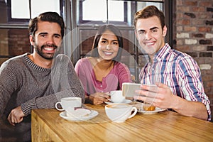 Group of friends looking at a smartphone