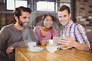 Group of friends looking at a smartphone