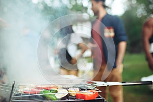 Group of friends making barbecue in the backyard. concept about good and positive mood with friends