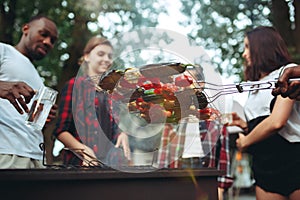 Group of friends making barbecue in the backyard. concept about good and positive mood with friends