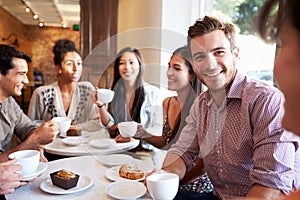 Group Of Friends Meeting In Cafe Restaurant