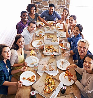 Group, friends and party with pizza, diversity and high angle for joy or celebration for youth. Men, women and fast food