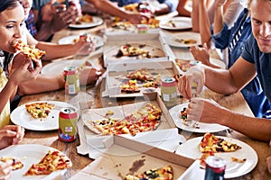 Group, friends and party with pizza, eating and diversity for joy or fun with youth. Men, women and fast food with drink