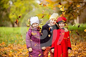 Group of friends play in autumn park