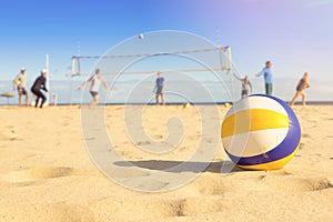 Group of friends playing beach volleyball