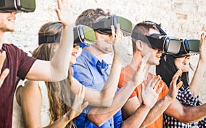 Group of friends playing on virtual reality vr goggles photo