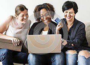 Group of friends purchasing products online