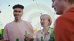 Group friends relaxing together at rooftop closeup. Colleagues enjoying party