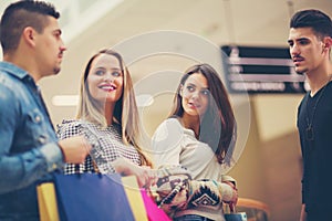 Group Of Friends Shopping In Mall Together