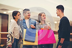 Group Of Friends Shopping In Mall Together