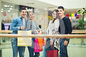 Group Of Friends Shopping In Mall Together