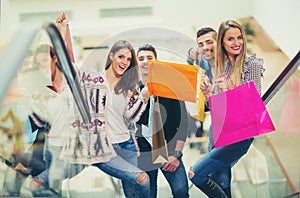 Group Of Friends Shopping In Mall Together