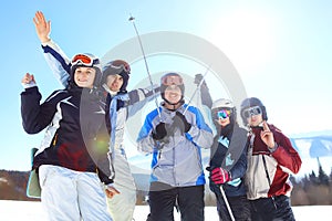 Group of friends with ski on winter holidays - Skiers having fun on the snow. selective focus