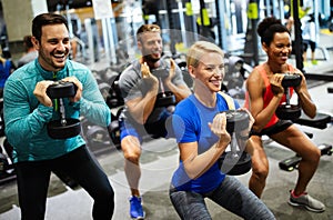 Group of friends smiling and enjoy sport in gym