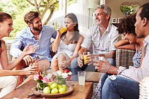 Group of friends socialising in a conservatory