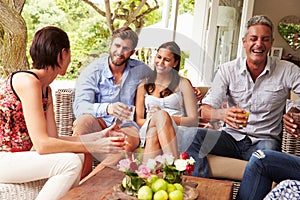 Group of friends socialising in a conservatory