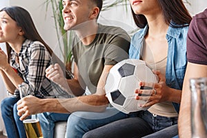 Group of friends sport fans watching soccer match support close-up