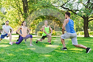 Group of friends or sportsmen exercising outdoors