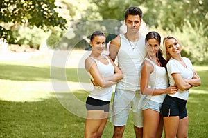 Group of friends in sportswear at the park